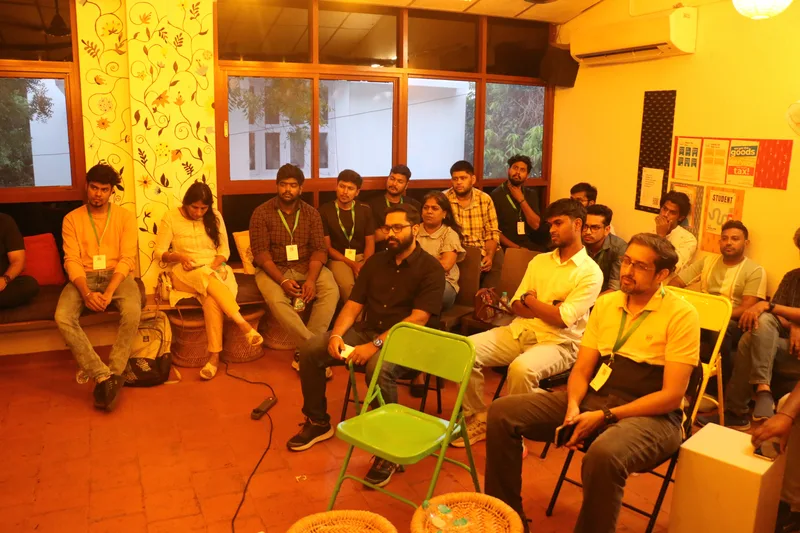 The circle mid-discussion under warm light at Circa, Chennai.