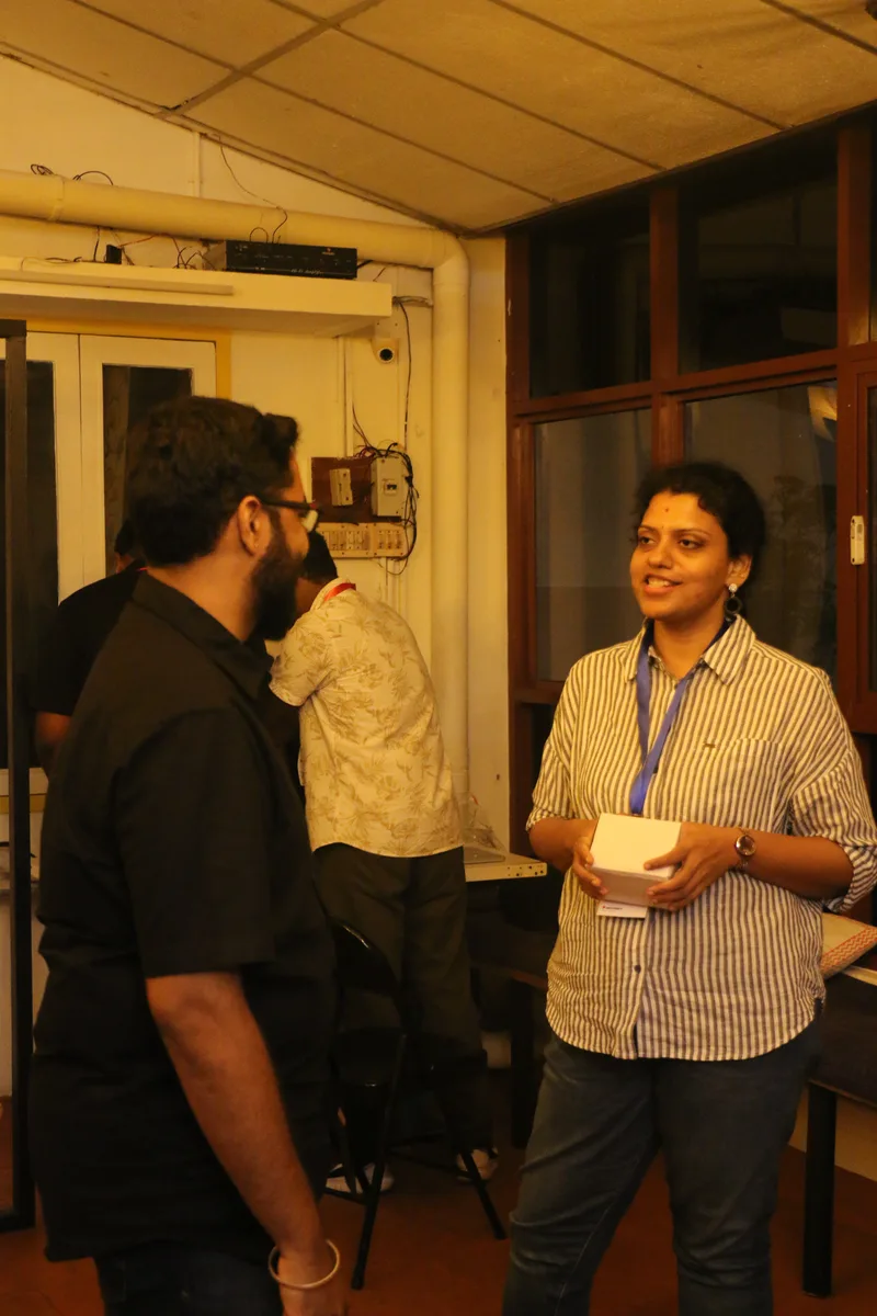 Two attendees mid-conversation at Circa, Chennai.