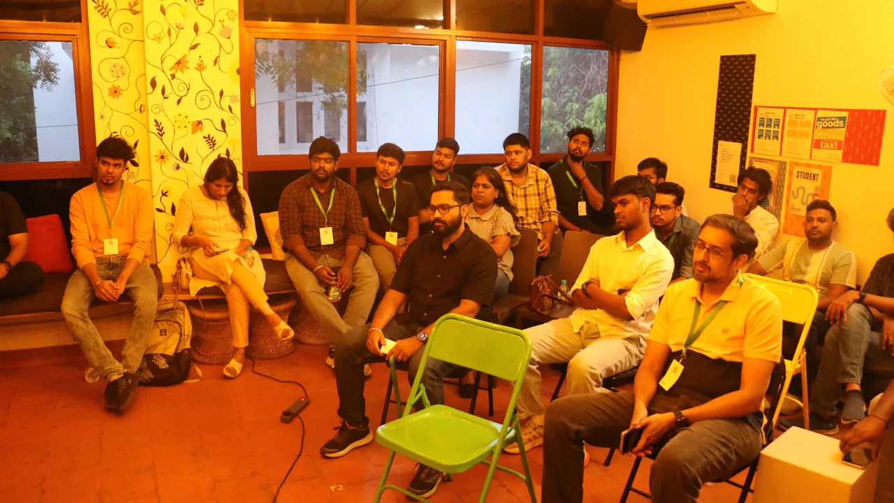 The circle mid-discussion under warm light at Circa Vol. 01, Chennai.