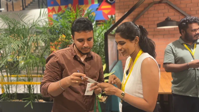 Two attendees comparing notes at Circa Vol. 03, The Hive, OMR, Chennai.